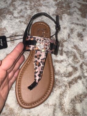 bebe Leopard Print T-Strap Sandal in Brown and Black with Buckle Accent